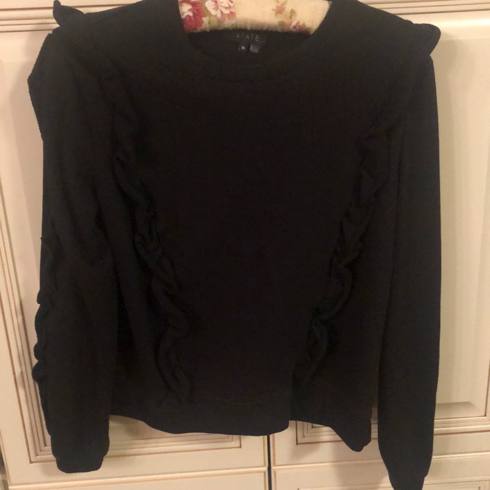 1 State ruffled sweatshirt.